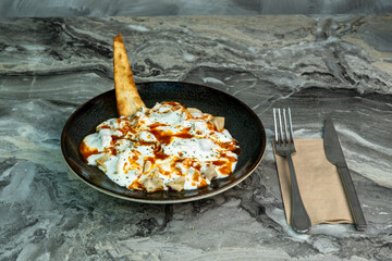 Turkish Ravioli Recipe (Mantı) on marble floor