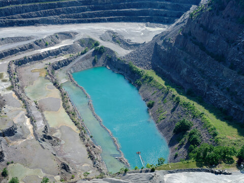 USA, Virginia, Manassas, Aerial view of turquoise pond in limestone quarry