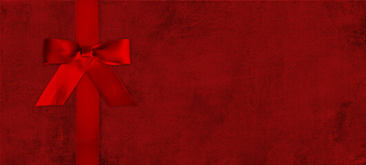 red bow on a red background