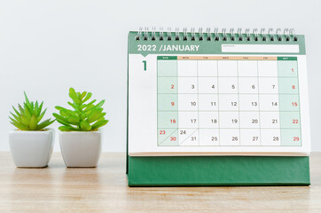 January 2022 desk calendar on the table.