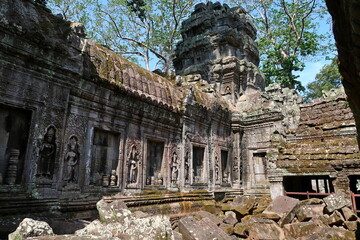 The ancient temple complex of Angkor Wat is buried in the jungle.