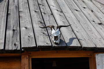 Goat skull above the entrance to the dwelling