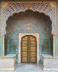 Rose gate at the City Palace complex Jaipur Rajasthan India. The Rose Gate represents winter and is...