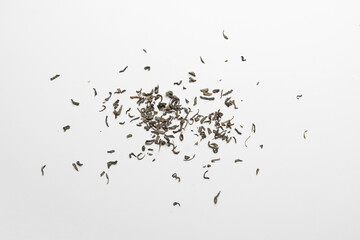 dry indian tea leaves flat lay on the colored surface, minimalistic concept