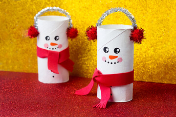 Handmade craft project from toilet tube. Creative kids DIY New year. Cute Snowman for Christmas party