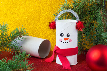 Handmade craft project from toilet tube. Creative kids DIY New year. Cute Snowman for Christmas party
