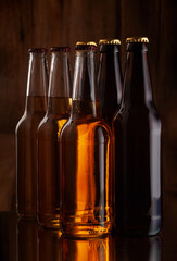 beer bottles on the background of a wooden wall