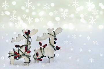 Christmas card with reindeers, snow and snow flakes, copy space