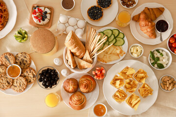 Dishes with different food on table, flat lay. Luxury brunch