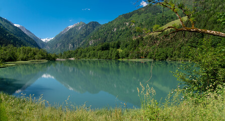 Fototapeta premium Walking around the Klammsee near Kaprun in Salzbur, Austria. The Klammsee is one of the reservoirs for the power plant in Kaprun.