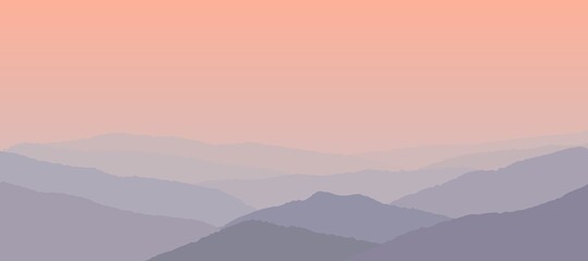 Beautiful pink sunset over the foggy mountains.
