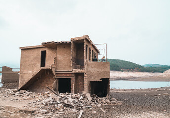 Fototapeta na wymiar In 1992 the Galician village of Aceredo was deliberately flooded and submerged underwater. Every few years when the water levels are low, this Spanish 'pueblo' reappears. 