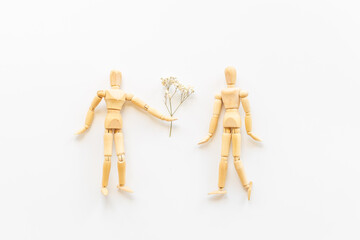 Couple of wooden figures - man and woman connection. Love and dating concept