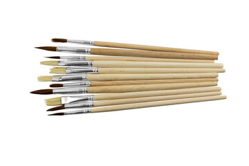 set of paint brushes in a row on white isolated background, copy space, top view