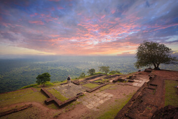 Lovely sunset with clouds with view from the sigiriya rock. Trees, Temple, Landscape. Tourists,...
