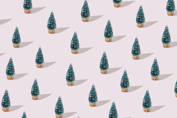 Pattern made of snowy pine trees. Minimal Christmas holidays concept.