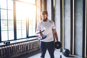 Strong man exercising in gym