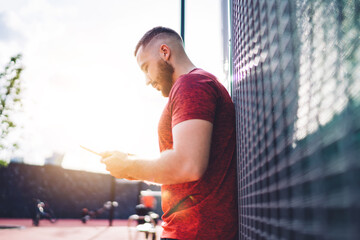 Man using smartphone on street