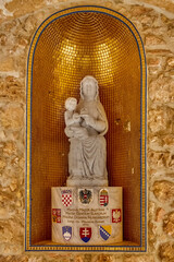 Jerusalem, Israel - 23 november 2021: Statue at entrance to the Austrian Hospice of Holy Family, it...