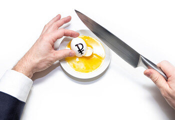 Male hands, a businessman holds eggs with the symbol of the Russian ruble in his hands and breaks...