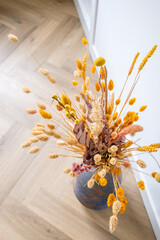 Flowers in vase in living room