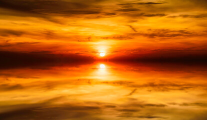 Dramatic sunset over mountain and sea.