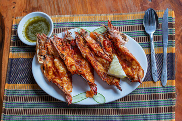 Grilled tiger prawns on the plate in a fish restaurant in Ngapali, Myanmar, Burma