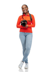 people, profession and photography concept - happy young woman with digital camera over white background