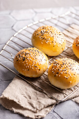Freshly baked burger buns on a table