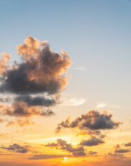 Naklejka premium Sunset sky vertical in the evening with orange sunlight on golden hour