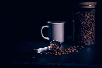 Fresh coffee beans, coffee kettle, coffee cup
