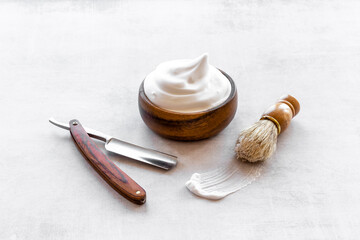 Shaving razor and foam in bowl - barber tools equipment