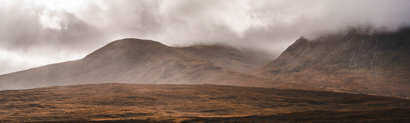 Glencoe mountain covered in mist in the Scottish countryside - obrazy, fototapety, plakaty