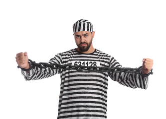 Prisoner in special uniform with chained hands on white background