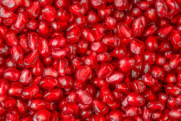Pomegranate peeled seeds background. Top view, flat lay