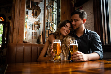 person with beer in the bar