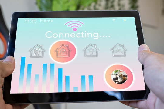 Woman holding smart home tablet