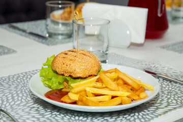 Fresh tasty burger and fries. Sandwich, potato chips. Fast food takeaway. Background