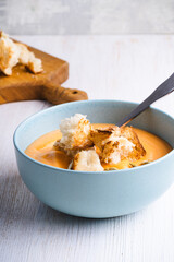 Creamy butternut squash soup with bread toast croutons