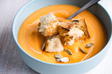 Creamy butternut squash soup with bread toast croutons