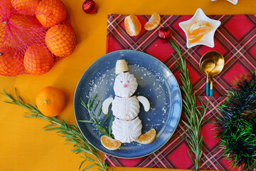Christmas dish. Snowman made of food. 