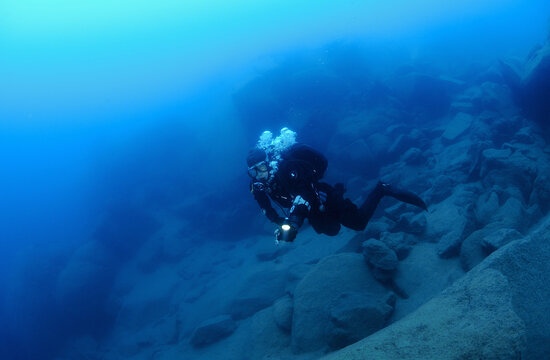 Scuba diver in deep freah water lake, Lake Tahoe, California, USA