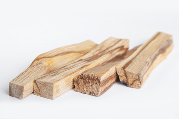 Palo Santo bars close-up and copy space. Ritual cleansing with sacred ibiocai, meditation, aromatherapy with incense and candles..