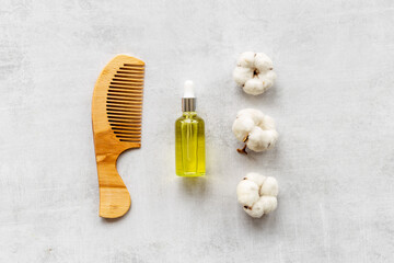 Hair treatment by cotton oil with hair comb. Top view
