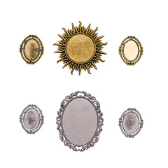 Gold and silver brooches isolated on a white background.