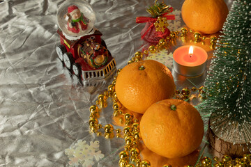 Fototapeta na wymiar christmas still life with orange and candle