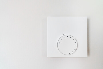 Thermostat for floor heating in the room.