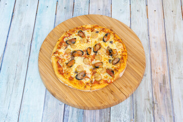 Sea flavor pizza with mussels, prawns and mozzarella cheese with salt and oregano