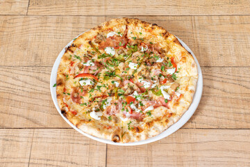 Pizza flavored with Mexican fajitas cooked in the stone oven