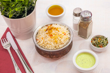 Pilaf, pulaw or pulau is a traditional way of cooking rice, with vegetables, lamb or beef, chicken or sometimes fish, and with spicy seasonings.